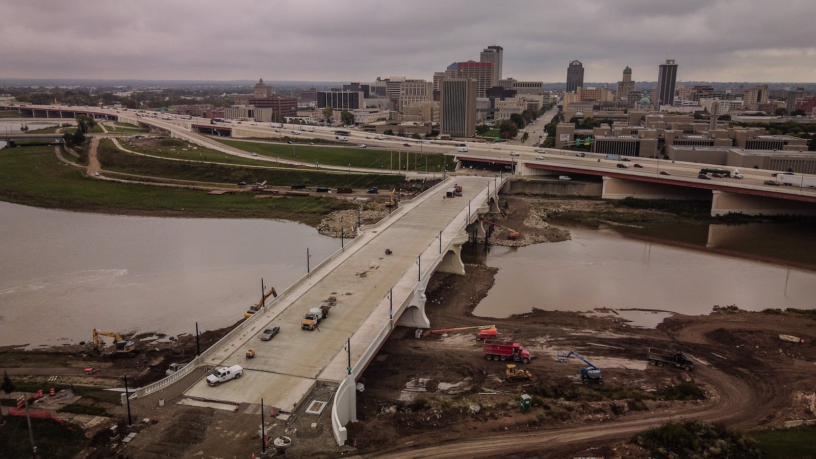 The new Third Street bridge is nearly completed. Workers are now sealing the concrete and working with heavy equipment near the river under the bridge. JIM NOELKER/STAFF