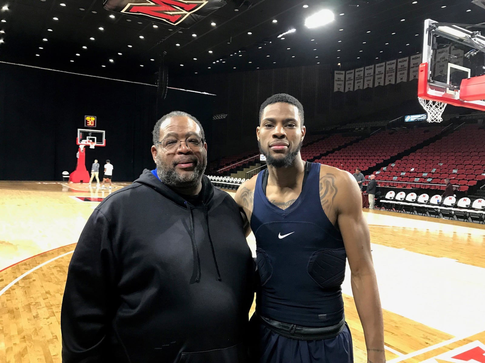 Akron’s Xeyrius Williams, a Wayne High School graduate, and his father, Cliff, after Tuesday night’s game vs. Miami at Millett Hall. Tom Archdeacon/CONTRIBUTED