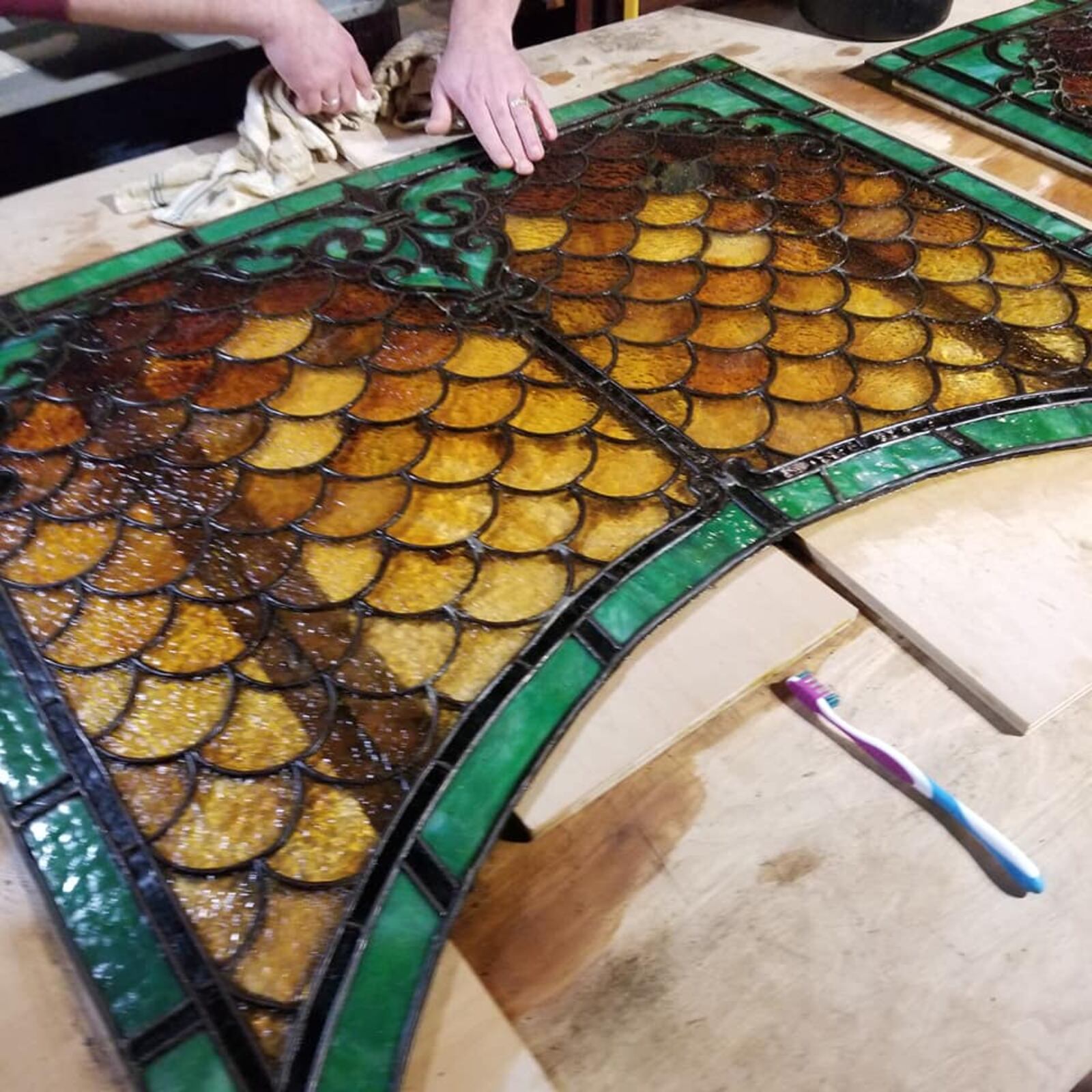 The Century Bar began posting progress photos at its new location on Facebook after closing following a New Year's Eve bash. This photo posted Jan. 5, 2020 shows the state of one of the bar's stain glass bar panel after it was cleaned.