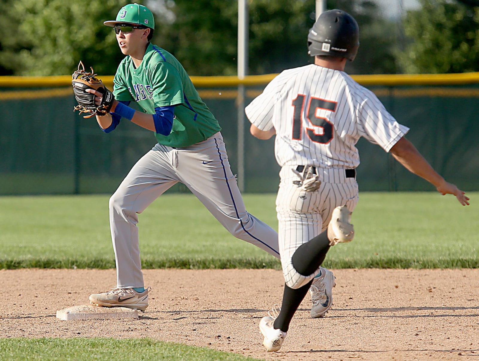 Chaminade Julienne second baseman Nick Wissman gets the force on Waynesville’s Mason Callahan to end their Division II regional semifinal at Mason on Friday. CONTRIBUTED PHOTO BY E.L. HUBBARD