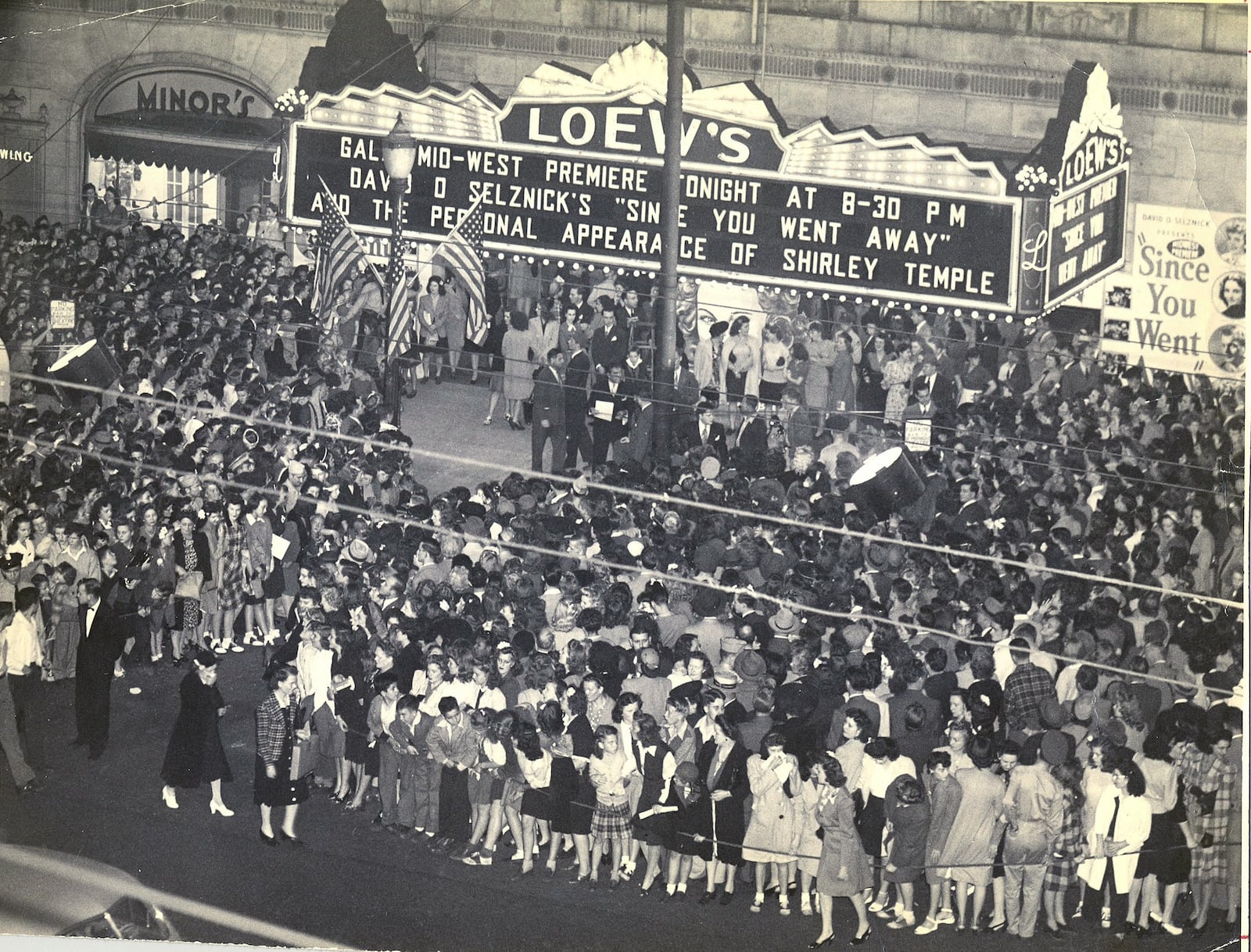 A crowd fills the sidewalk outside the old Loew's Theater on Main Street in Dayton. The marquee lists a showing of "Since You Went Away," which was released in 1944, and a personal appearance by Shirley Temple, who had a role in the movie.