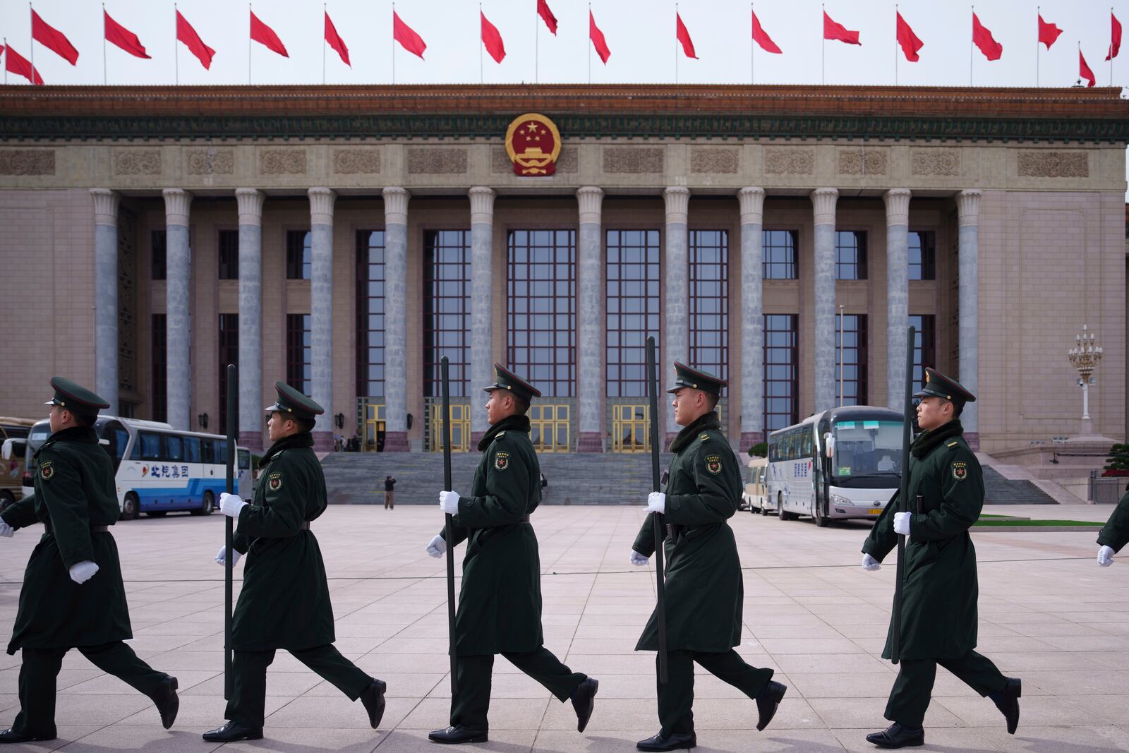 Chinese paramilitary policemen petrol ahead of the opening of the Chinese People's Political Consultative Conference outside at the Great Hall of the People in Beijing, China, Monday, March 3, 2025. (AP Photo/Vincent Thian)