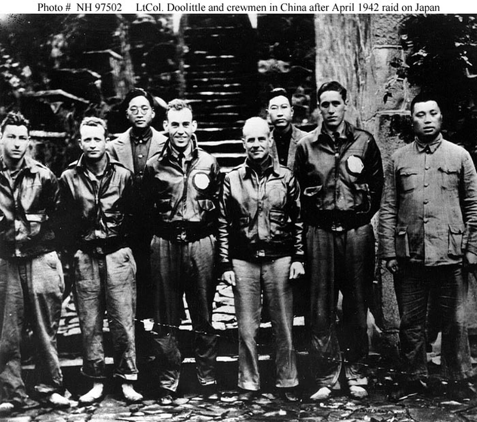 Photo #: NH 97502 Doolittle Raid on Japan, April 1942 Lieutenant Colonel James H. Doolittle, USAAF, (center) with members of his flight crew and Chinese officials in China after the 18 April 1942 attack on Japan. Those present are (from left to right): Staff Sergeant Fred A. Braemer, Bombardier; Staff Sergeant Paul J. Leonard, Flight Engineer/Gunner; General Ho, director of the Branch Government of Western Chekiang Province; Lieutenant Richard E. Cole, Copilot; Lt.Col. Doolittle, Pilot and mission commander; Henry H. Shen, bank manager; Lieutenant Henry A. Potter, Navigator; Chao Foo Ki, secretary of the Western Chekiang Province Branch Government. Official U.S. Army Air Forces Photograph, from the collections of the Naval Historical Center.