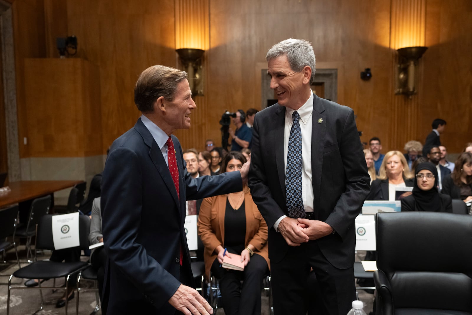 Federal Aviation Administration (FAA) Administrator Mike Whitaker, right, is greeted by Sen. Richard Blumenthal, D-Conn., left, before testifying at a Senate Committee on Homeland Security and Governmental Affairs, Subcommittee on Investigations, hearing on the FAA's oversight of Boeing, on Capitol Hill in Washington, Wednesday, Sept. 25, 2024. (AP Photo/Ben Curtis)