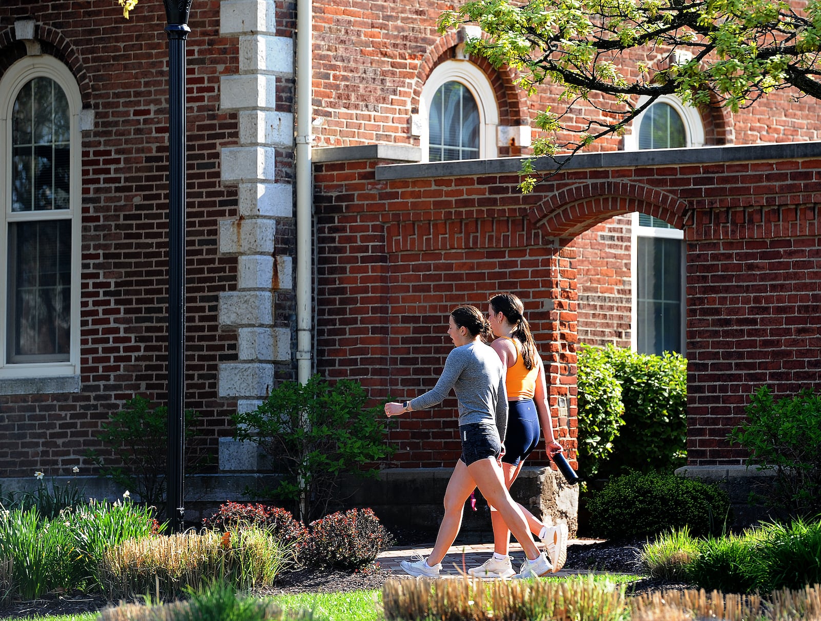 University of Dayton students enjoy walking around campus on a warm Tuesday morning, April 16, 2024. MARSHALL GORBY\STAFF