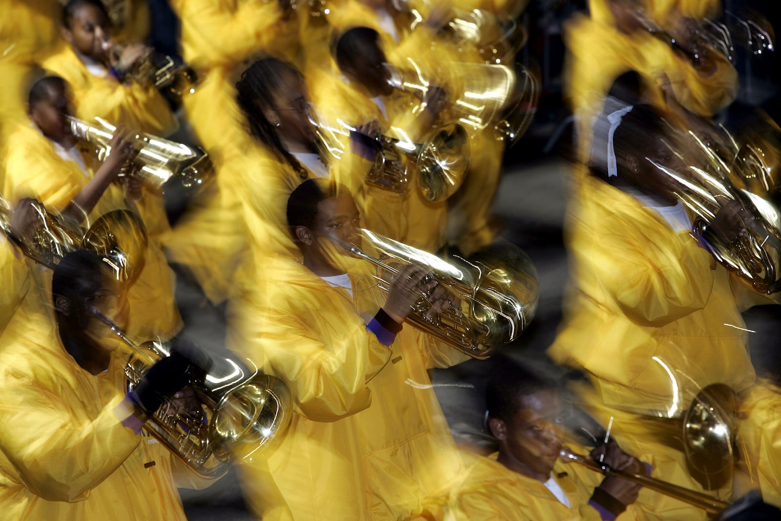 FILE - The brass section of the MAX high school band marches during the Hermes Parade on St. Charles Ave., in New Orleans, Feb. 24, 2006. (AP Photo/Carolyn Kaster, File)