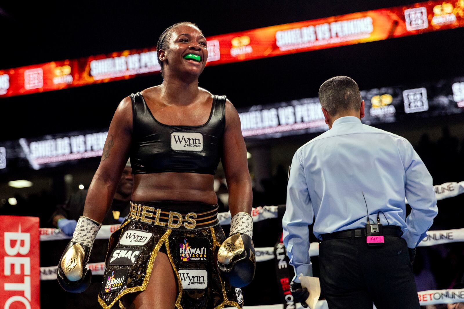 Claressa Shields, left, celebrates after defeating Danielle Perkins during the undisputed heavyweight title match on Sunday, Feb. 2, 2025 at Dort Financial Center in Flint. (Jake May/The Flint Journal via AP)