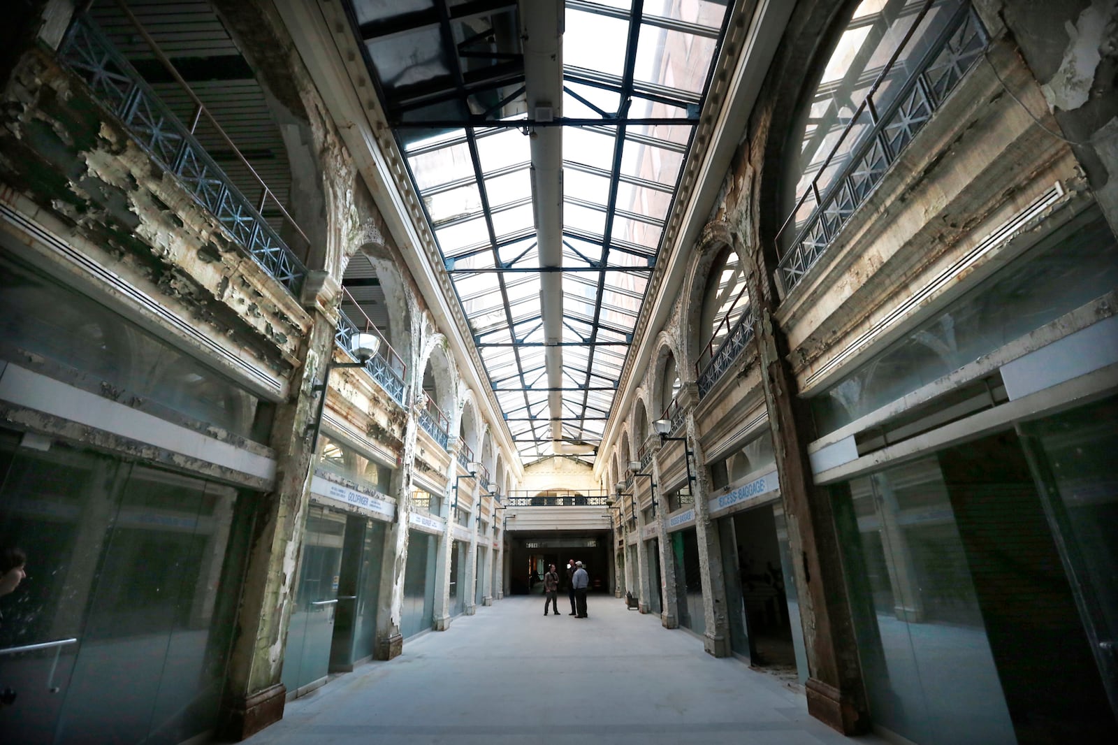 The Dayton Arcade, which opened in 1904, closed its doors for good in 1991. Shops once  lined this passageway that leads from the Third Street entrance to the center rotunda area. LISA POWELL / STAFF