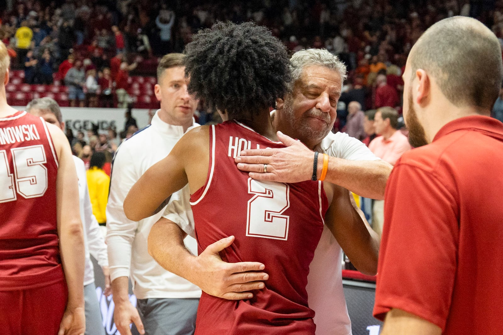 Auburn head coach Bruce Pearl hugs former Auburn player Aden Holloway (2), who now plays for Alabama, after an NCAA college basketball game, Saturday, Feb. 15, 2025, in Tuscaloosa, Ala. (AP Photo/Vasha Hunt)