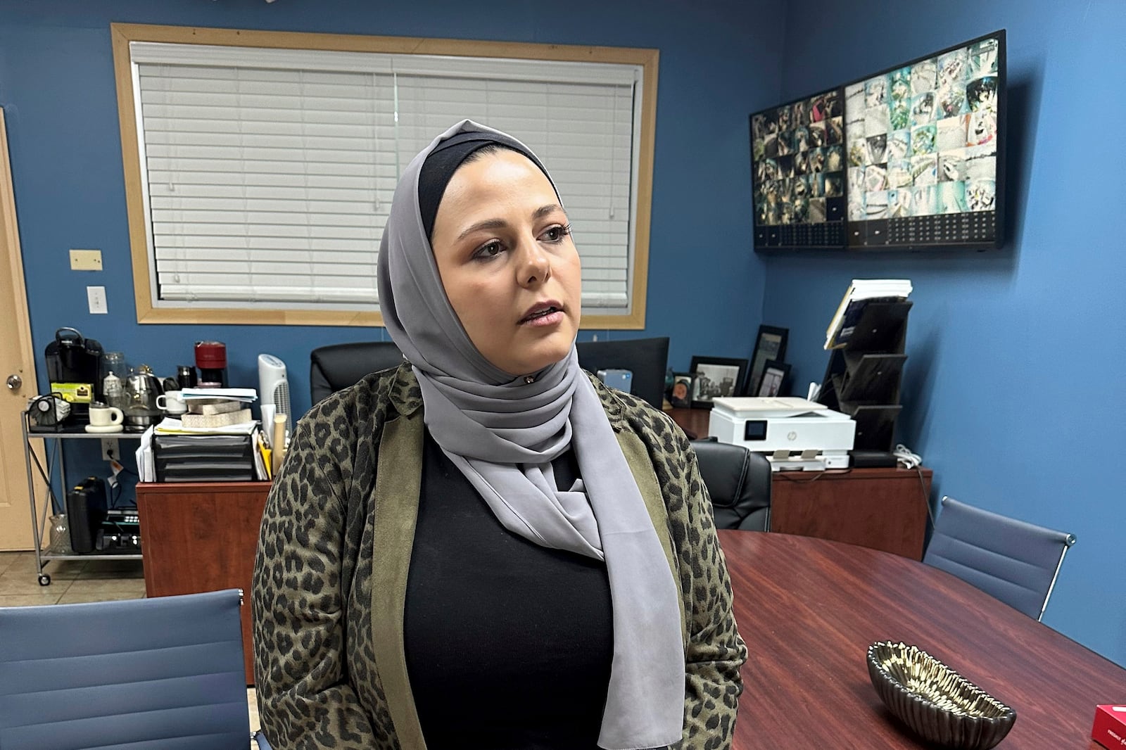 Rama Alhoussaini stands in her office in Dearborn Heights, Mich., Tuesday, Dec. 10, 2024. (AP Photo/Corey Williams)