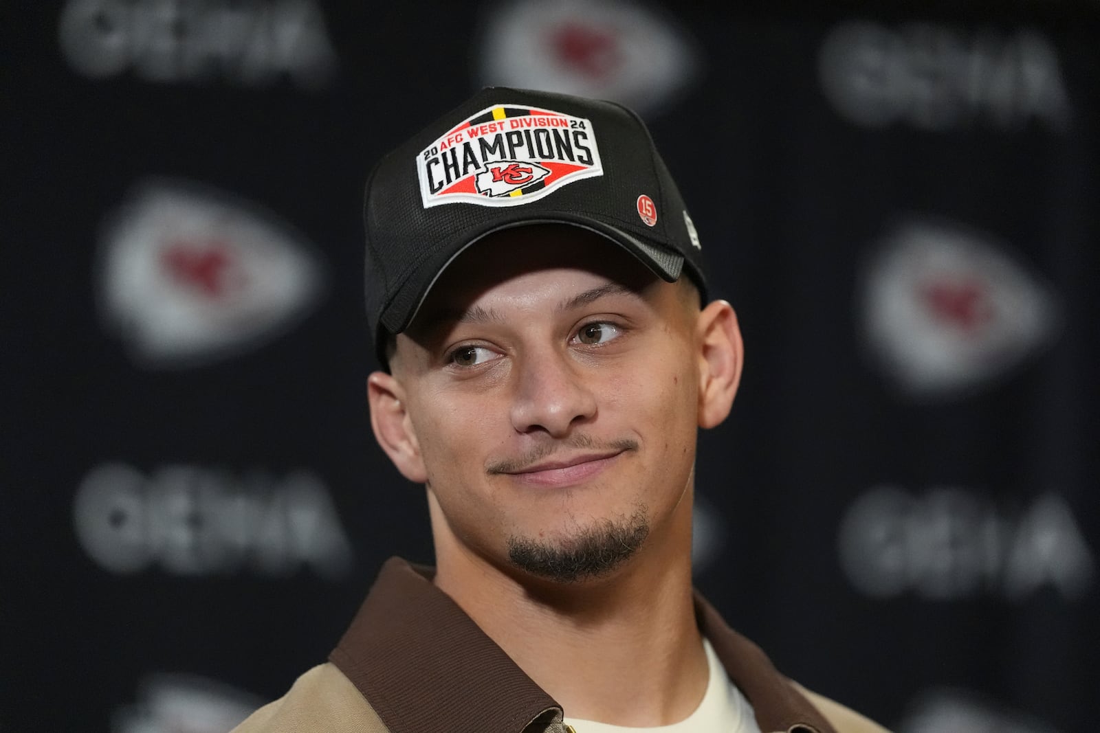 Kansas City Chiefs quarterback Patrick Mahomes speaks during a news conference following an NFL football game against the Los Angeles Chargers Sunday, Dec. 8, 2024, in Kansas City, Mo. (AP Photo/Charlie Riedel)