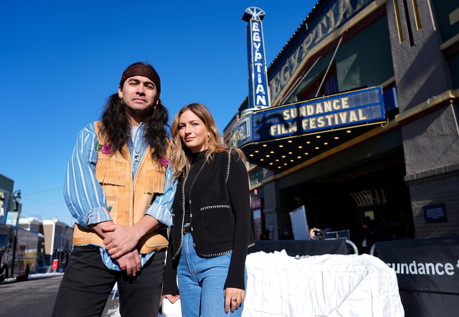 Julian Brave NoiseCat, left, and Emily Kassie, co-directors of the Oscar-nominated documentary film "Sugarcane," pose for a portrait outside the Egyptian Theatre during the Sundance Film Festival on Monday, Jan. 27, 2025, in Park City, Utah. (AP Photo/Chris Pizzello)