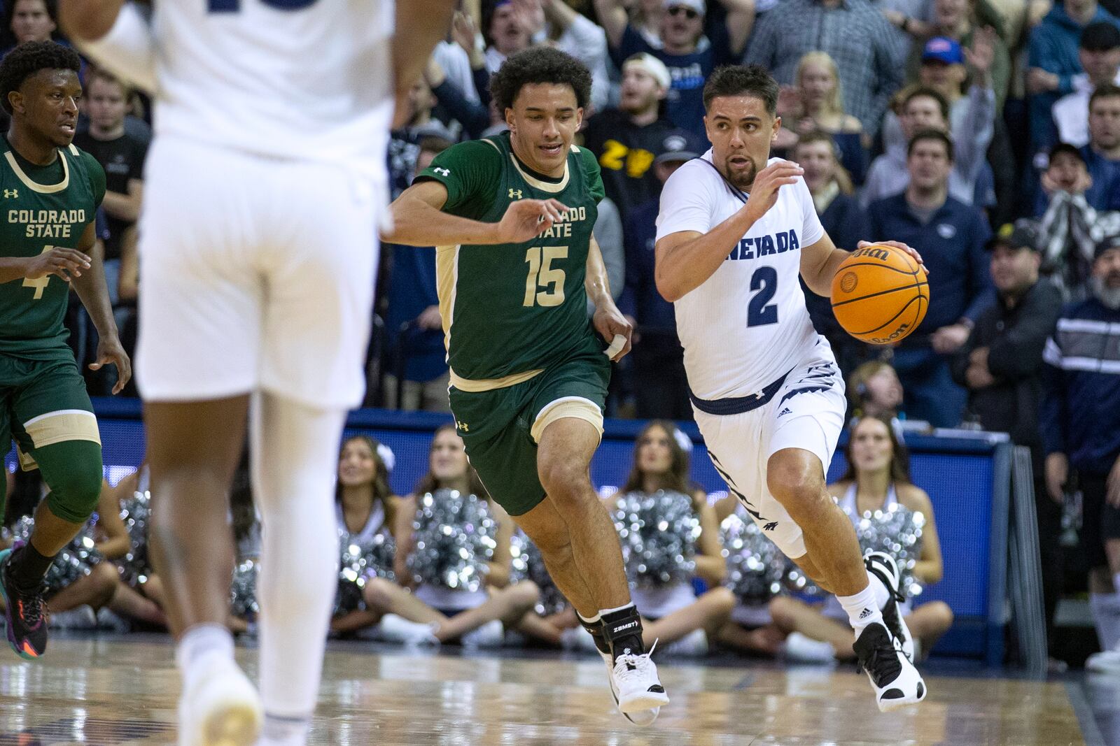 Nevada guard Jarod Lucas (2) brings the ball up as Colorado State guard Jalen Lake (15) defends during the second half of an NCAA college basketball game Wednesday, Jan. 24, 2024, in Reno, Nev. (AP Photo/Tom R. Smedes)