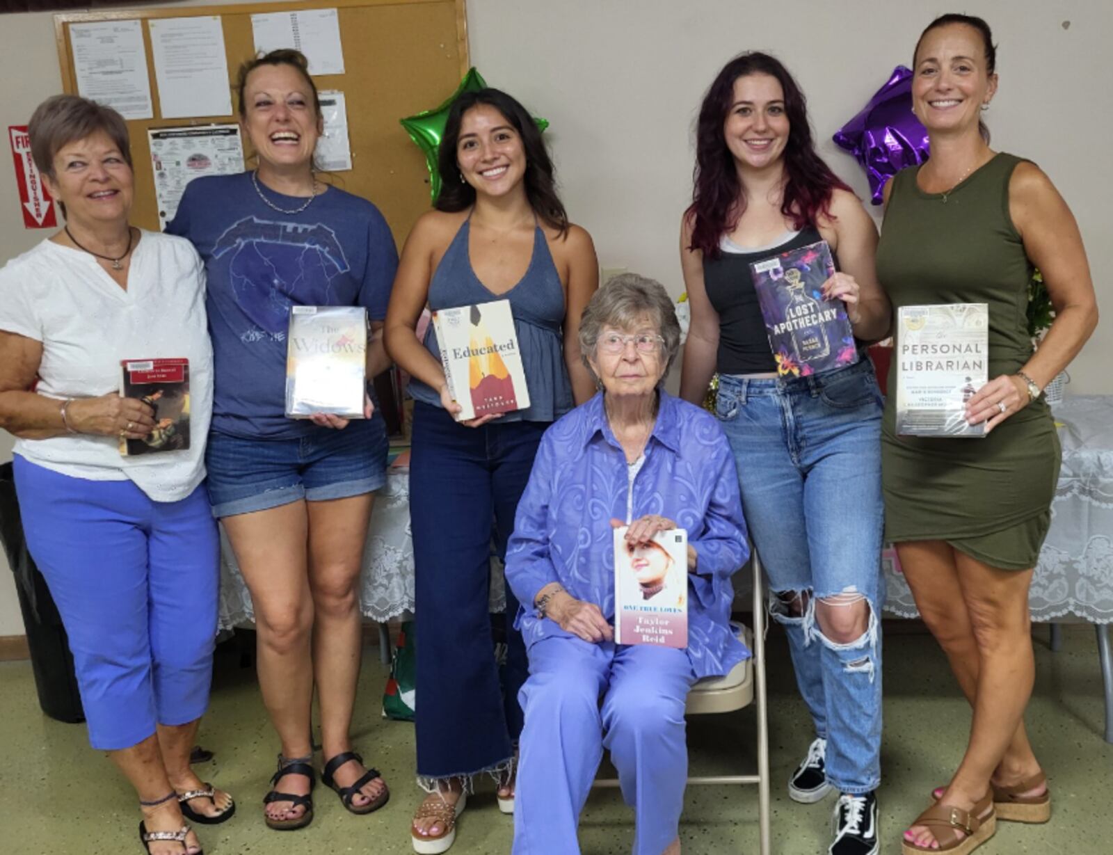 Granny Blanche Adkins at age 100 enjoys The Rowdy Readers book group with her children and grandchildren. Holding some of their favorite books and pictured left to right: Daughter Carol Todd, granddaughter  Aleasha Stein, great granddaughter Giuliana Vacca, great granddaughter Gianna Vacca and granddaughter Renee Vacca. CONTRIBUTED