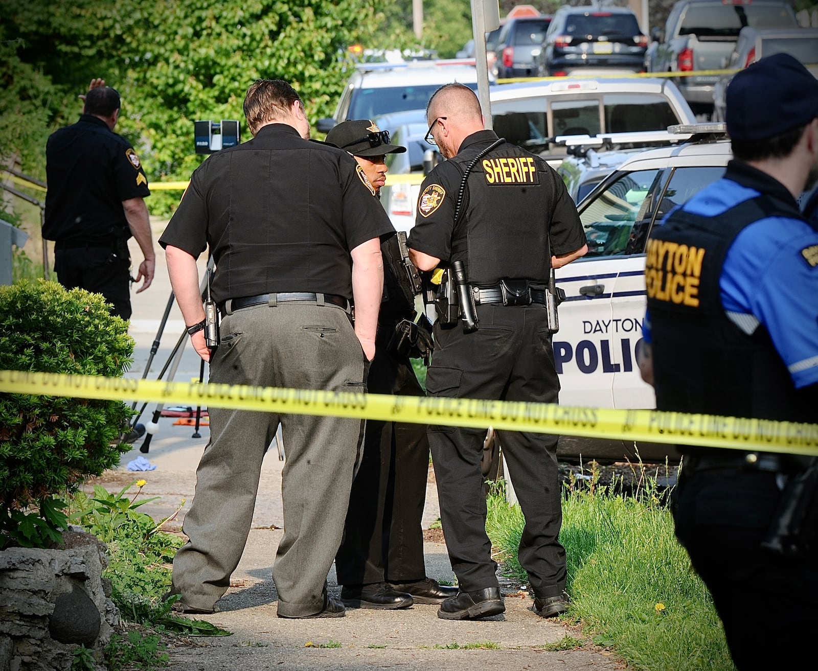 A man wielding a sword was shot by two Dayton police officers Wednesday, May 24, 2023, when he would not drop the weapon and charged the officers in the 1600 block of Suman Avenue off South Smithville Road. The man was shot at least twice in the legs. The Montgomery County Sheriff's Office is investigating. MARSHALL GORBY/STAFF