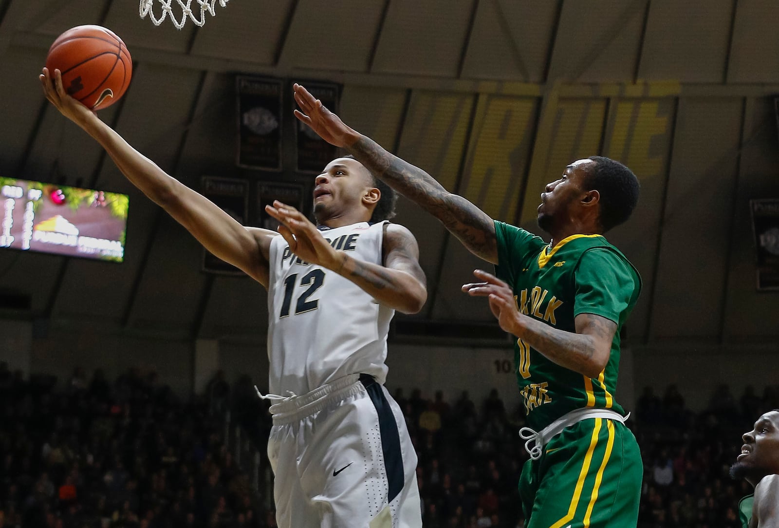 WEST LAFAYETTE, IN - DECEMBRER 21: Vince Edwards #12 of the Purdue Boilermakers shoots the ball as Carrington Ward #0 of the Norfolk State Spartans trails behind at Mackey Arena on December 21, 2016 in West Lafayette, Indiana. (Photo by Michael Hickey/Getty Images)