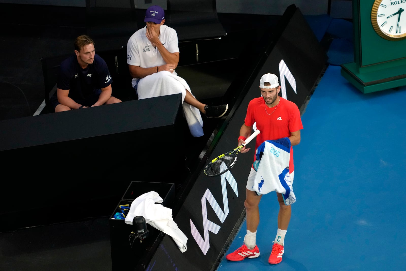 Jacob Fearnley of Britain stands by his coaches box during their first round match against Nick Kyrgios of Australia at the Australian Open tennis championship in Melbourne, Australia, Monday, Jan. 13, 2025. (AP Photo/Ng Han Guan)