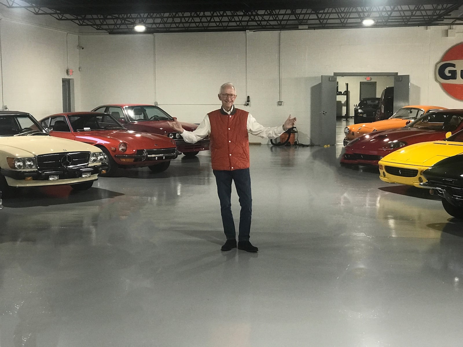 John Higgins with part of his extensive car collection that he has at his Killarney Park Garage. Tom Archdeacon/CONTRIBUTED