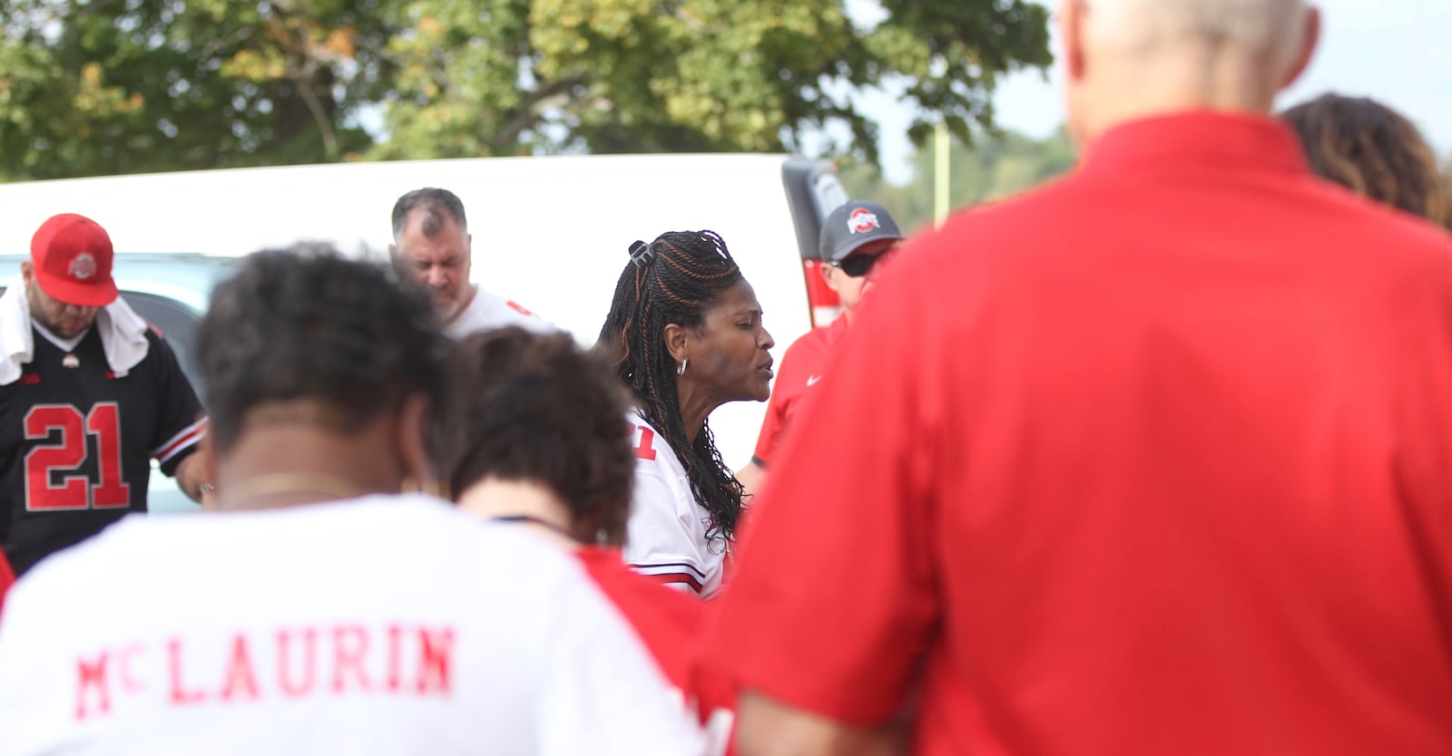 Shelly Woodruff, mother of Ohio State wide receiver Parris Campbell, leads a group of parents in prayer on Thursday, Aug. 31, 2017, at Memorial Stadium in Bloomington, Ind.