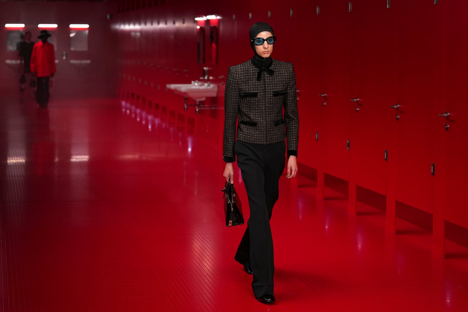 A model wears a creation as part of the Valentino Fall/Winter 2025-2026 Womenswear collection presented in Paris, Sunday, March 9, 2025. (Photo by Scott A Garfitt/Invision/AP)