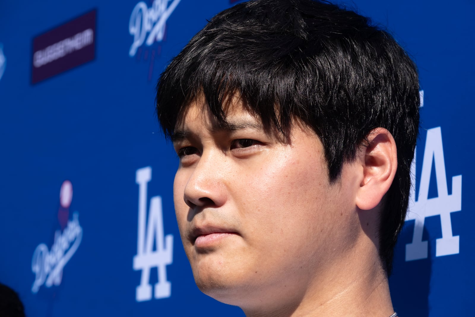 Los Angeles Dodgers' Shohei Ohtani talks to the media during a baseball interview during DodgerFest at Dodger Stadium, Saturday, Feb. 1, 2025, in Los Angeles. (AP Photo/Richard Vogel)