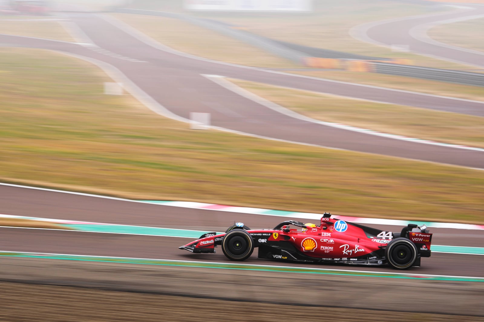 British driver Lewis Hamilton steers a Ferrari Formula One SF-23 at the Ferrari private test track, in Fiorano Modenese, Italy, Wednesday, Jan. 22, 2025. (AP Photo/Luca Bruno)