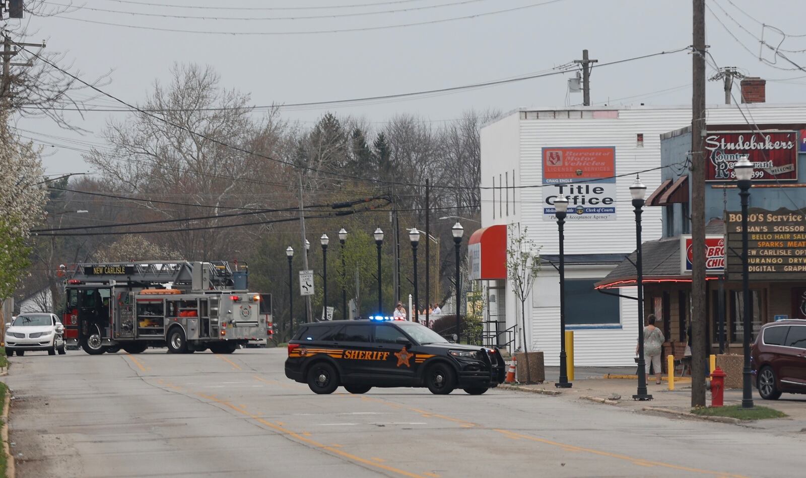 Main Street in New Carlisle is shut down due to a gas leak at the BMV building. BILL LACKEY/STAFF