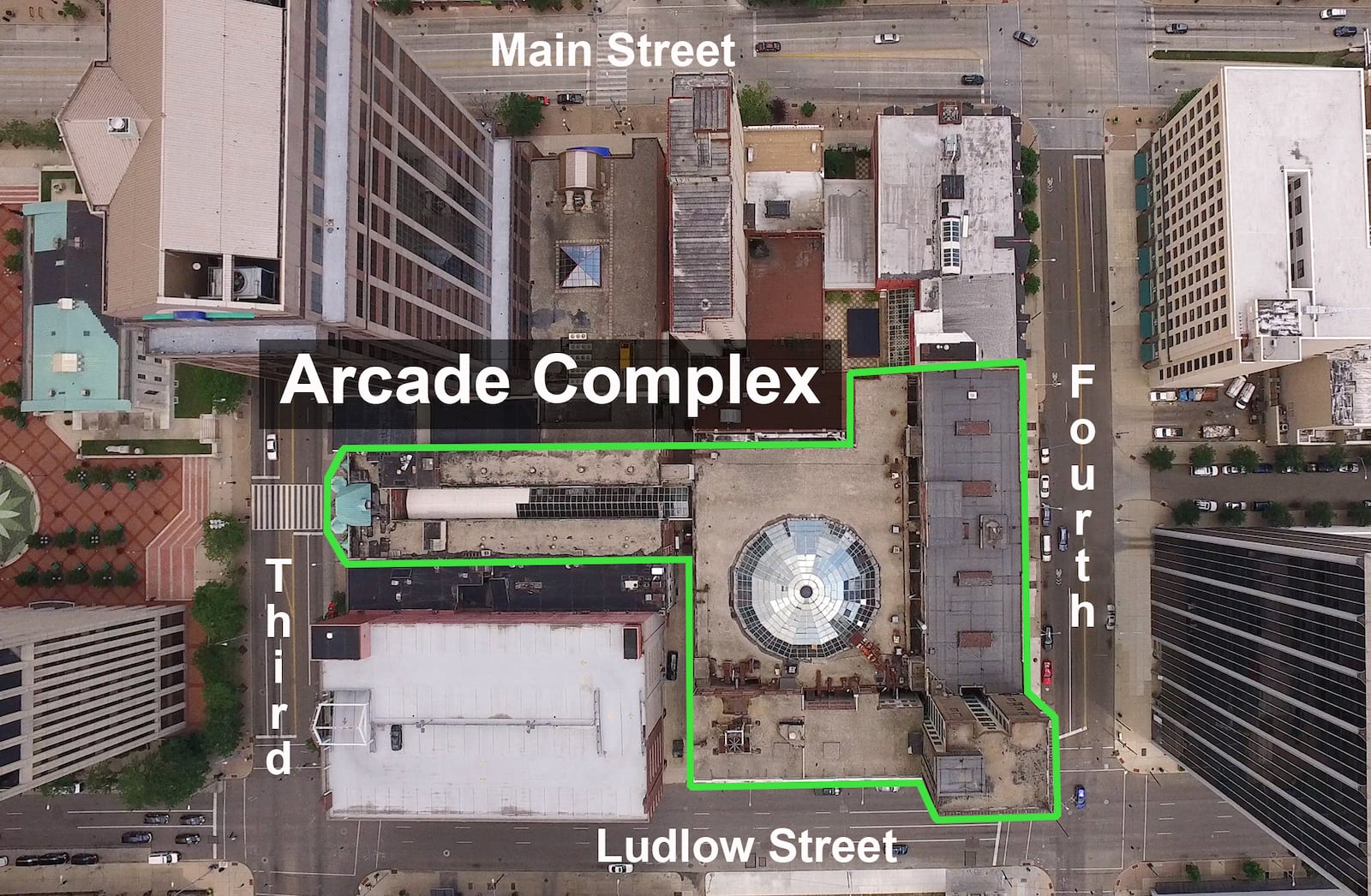 Straight down view of the Dayton Arcade complex.  Main Street is at the top, Ludlow at the bottom.  The Third Street Arcade entrance is at the left with the domed window over the Arcade Market area in the center.   TY GREENLEES / STAFF