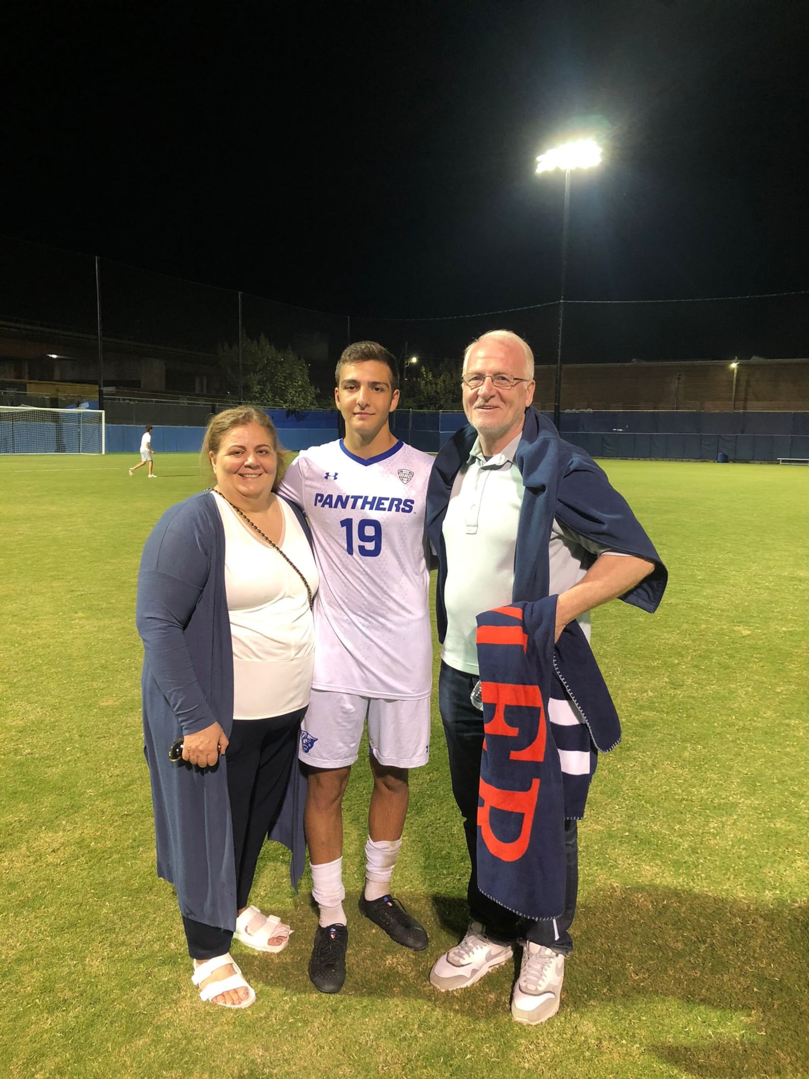 Ethan Sassine flanked by his mother Samira and his dad Raymond during his time playing at Georgia State. CONTRIBUTED