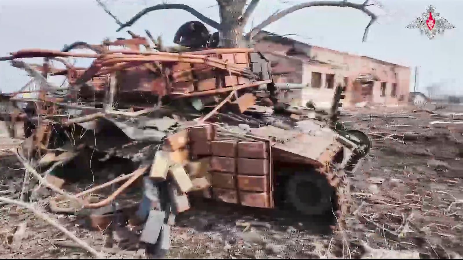 In this photo taken from video distributed by Russian Defense Ministry Press Service on Friday, March 14, 2025, A destroyed Ukrainian Army tank is seen at Cherkasskoe Porechnoe and Pravda in Sudzha district of the Kursk region of Russia after it was taken over by Russian troops. (Russian Defense Ministry Press Service via AP)