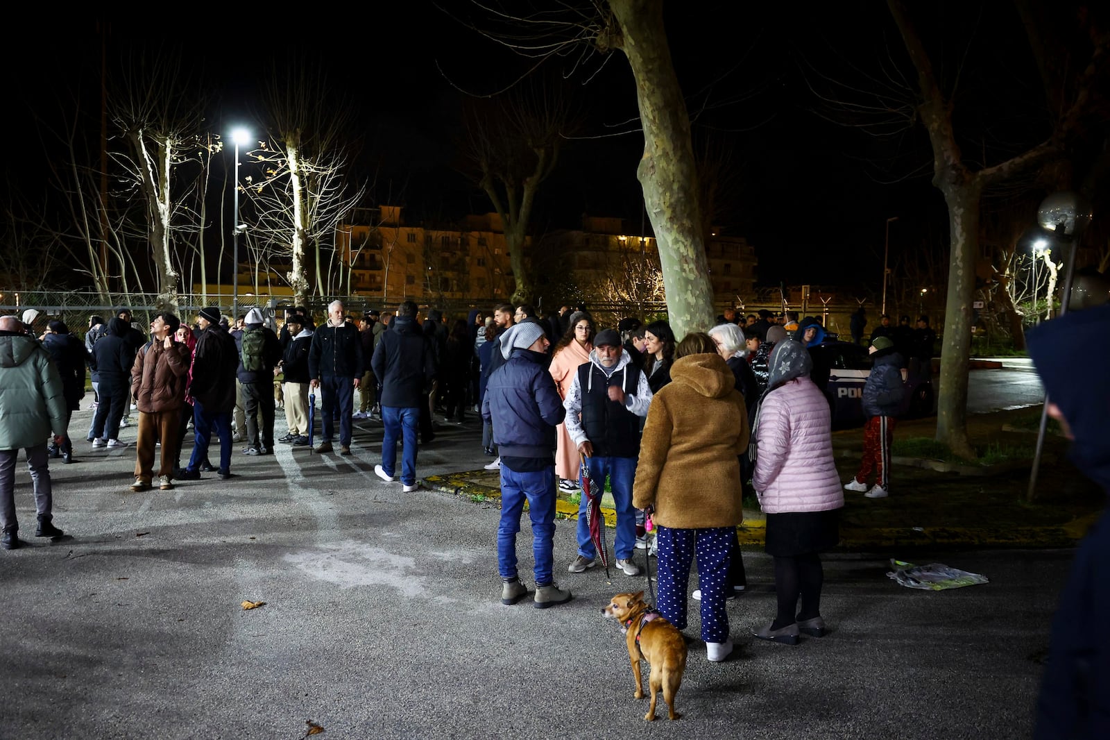 People seek safety in the streets following an earthquake north of Naples, Italy, Thursday, March 13, 2025. (Alessandro Garofalo/LaPresse via AP)