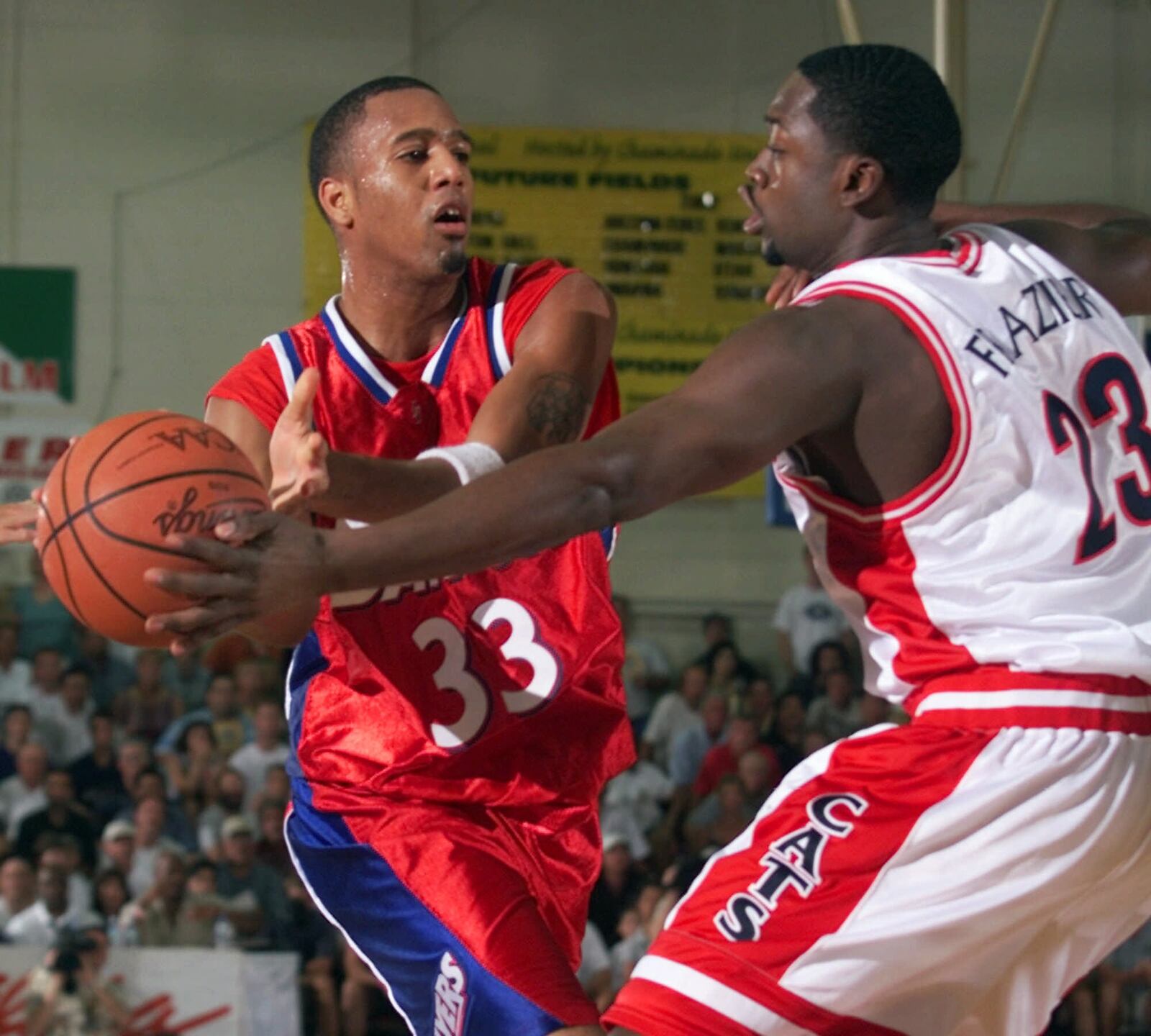 Arizona's Lamont Frazier, right, knocks the ball away from Dayton's Brooks Hall in the first half of a second-round game of the Maui Invitational in Lahaina, Hawaii Tuesday, Nov. 21, 2000. (AP Photo/Michael Conroy)