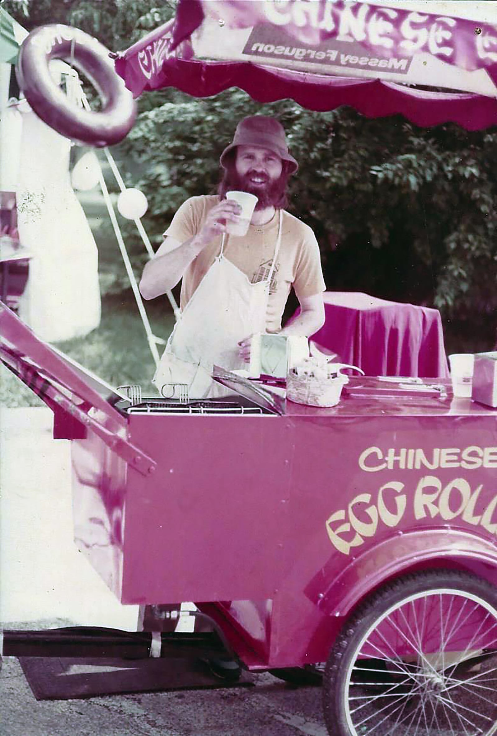 Spencer Myers in 1978 with his makeshift eggroll wagon in the Oregon District. He operated this one time ice cream cart for several years in Dayton. Myers included a chapter in his book written for his grandson about this cart and what it took to create this business.