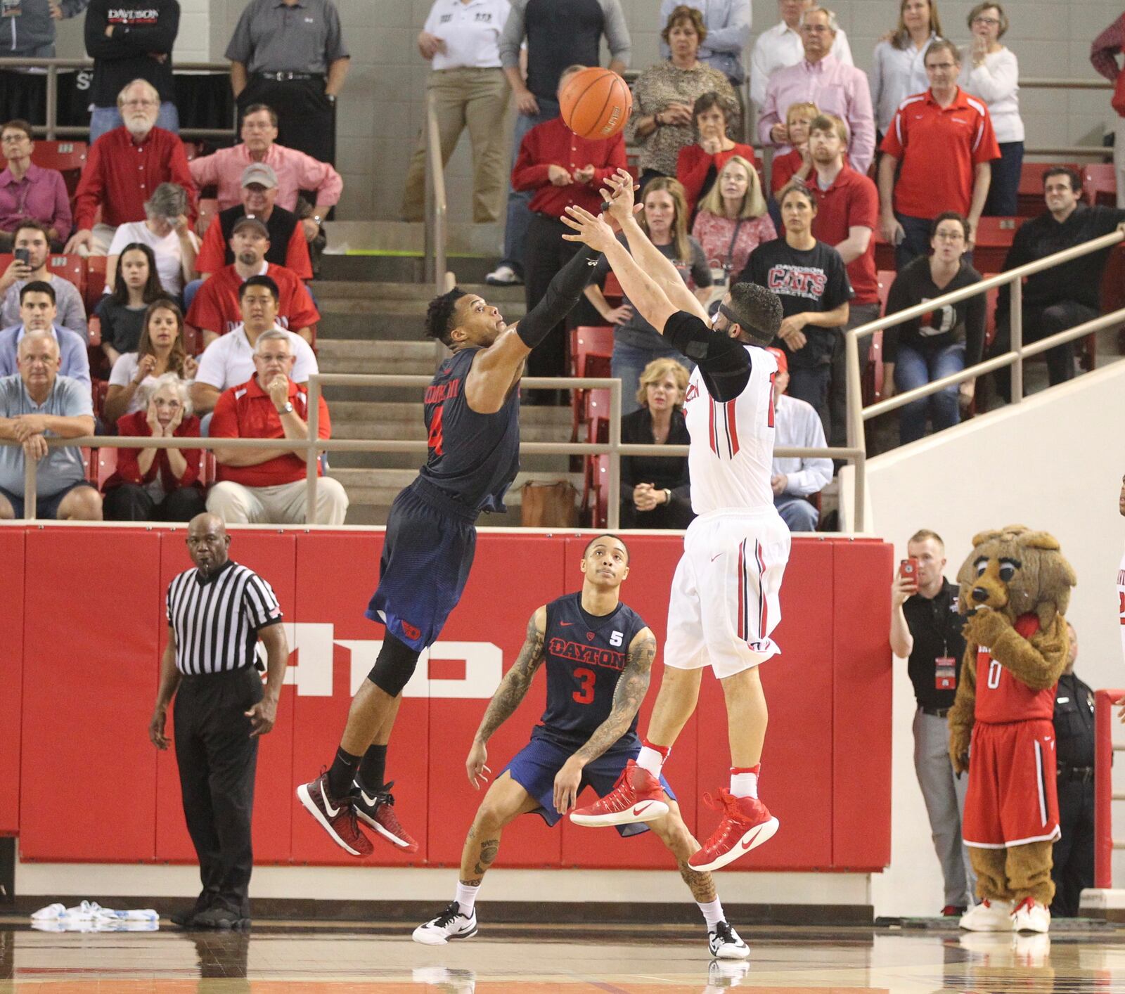 Dayton’s Charles Cooke guards against Davidson’s Jack Gibbs on Davidson’s final shot of the second half on Friday, Feb. 24, 2017, at Belk Arena in Davidson, N.C.