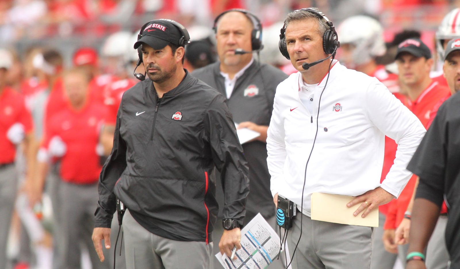 Ohio State’s Ryan Day, left, and Urban Meyer watch the action during a game against Tulane on Saturday, Sept. 22, 2018, at Ohio Stadium in Columbus. David Jablonski/Staff