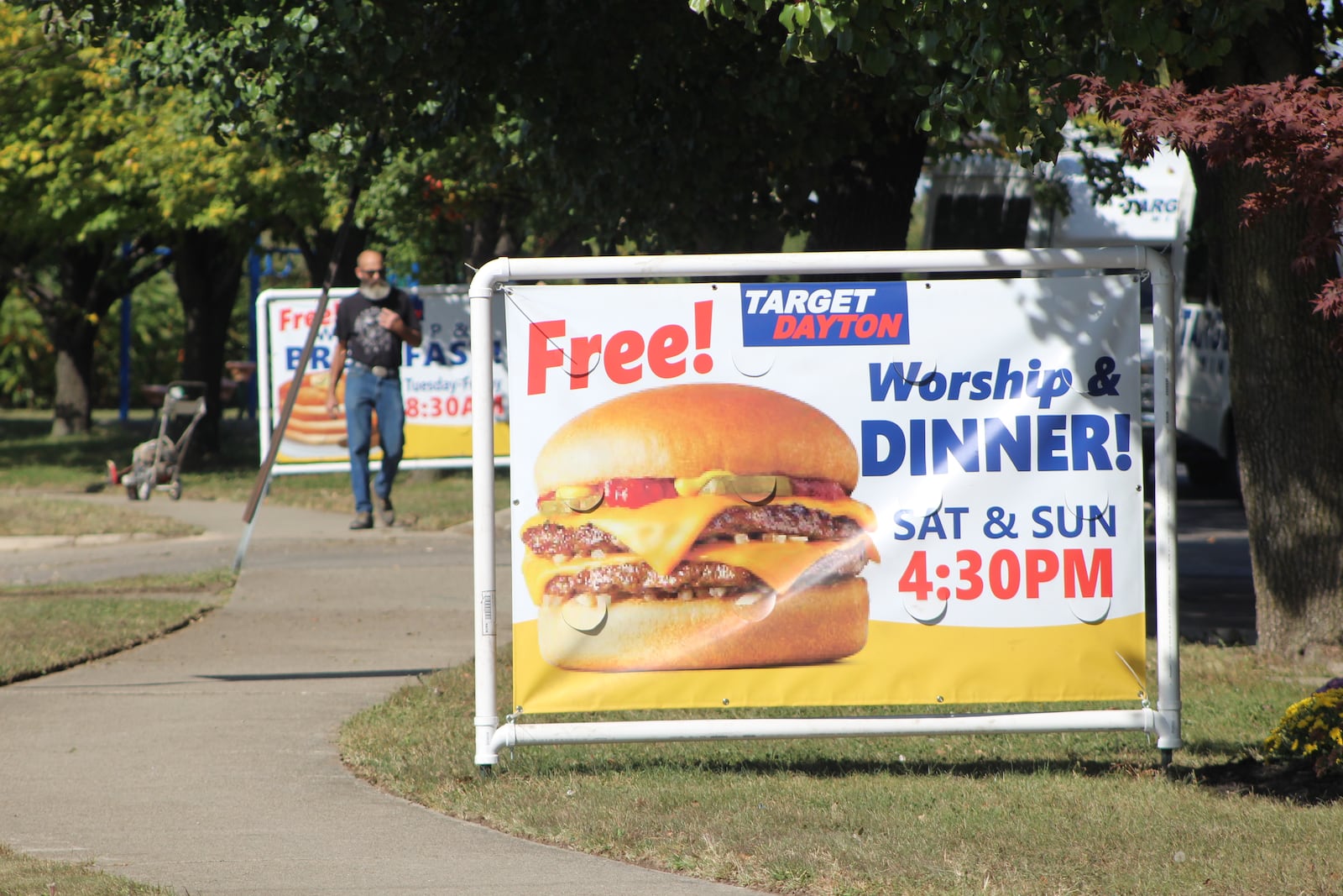 Target Dayton Ministries on Keowee Avenue in Dayton advertises for a worship where they offer dinner for the needy.