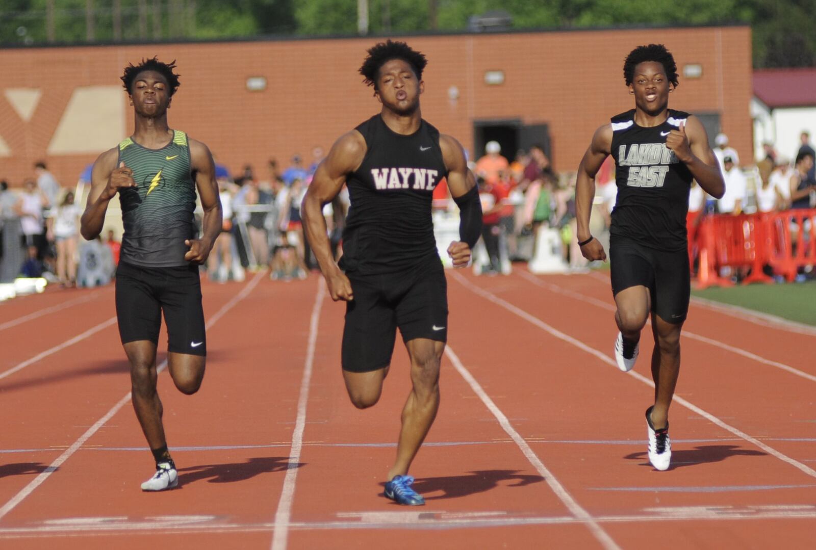 Wayne senior Zarik Brown (center) was first, Jazz Keys of Northmont (left) third and Rodney Heath of Lakota East eighth in the 100 meters during the D-I regional track and field meet at Wayne High School on Friday, May 24, 2019. MARC PENDLETON / STAFF