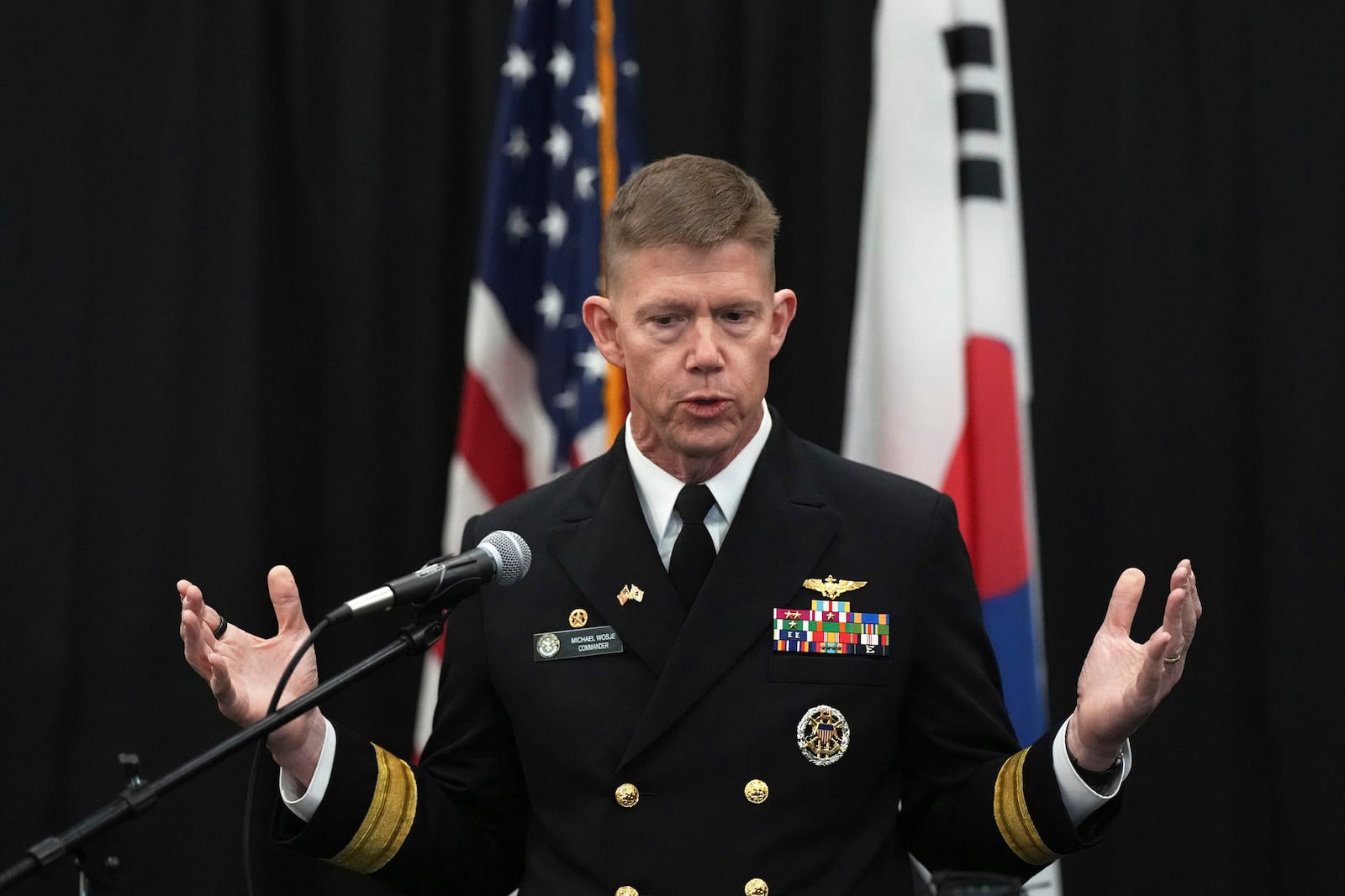 Rear Adm. Michael Wosje, U.S. commander of Carrier Strike Group ONE, speaks to the media at the Nimitz-class nuclear-powered aircraft carrier USS Carl Vinson at a port in Busan, South Korea, Monday, March 3, 2025. (AP Photo/Lee Jin-man, Pool)