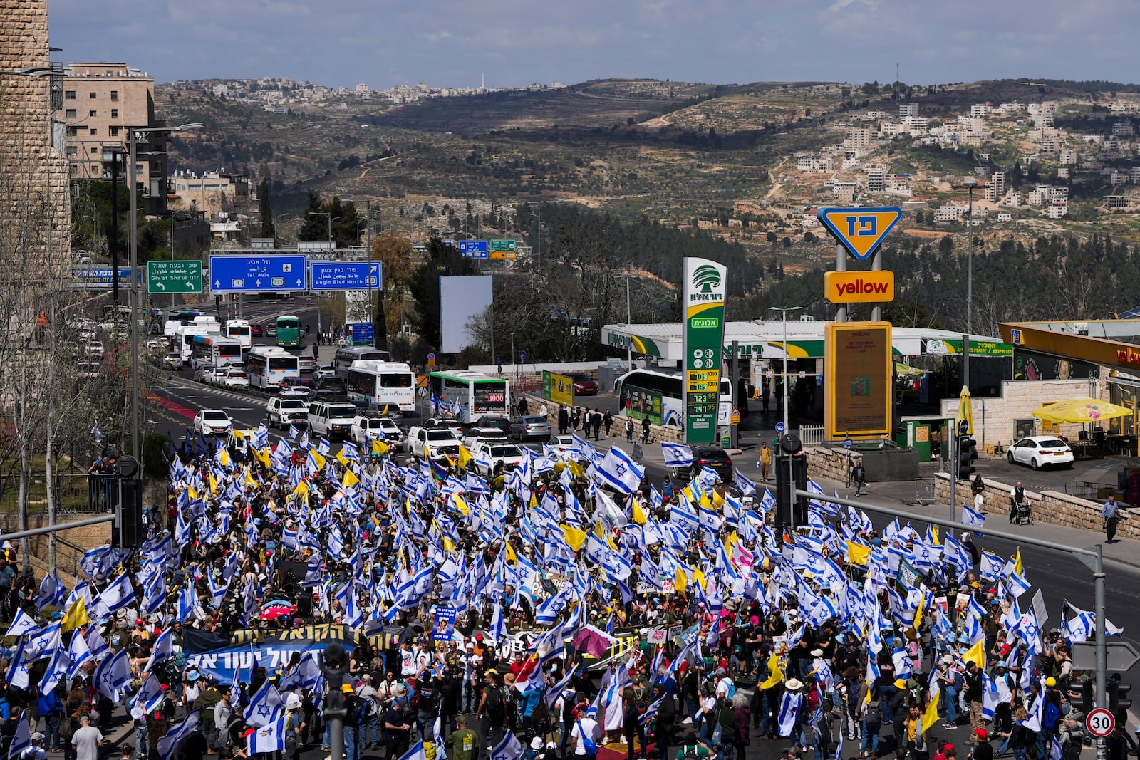 Israelis march in a protest against Prime Minister Benjamin Netanyahu and his plans to dismiss the head of the Shin Bet internal security service, in Jerusalem on Wednesday, March 19, 2025. (AP Photo/Ohad Zwigenberg)