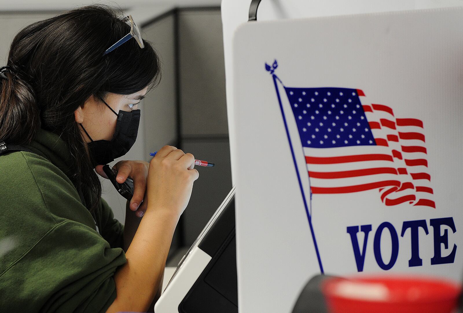 Victoria Mohr, looks over her ballot while early voting Thursday, Oct. 28, 2021 at the Board of Elections. MARSHALL GORBY\STAFF