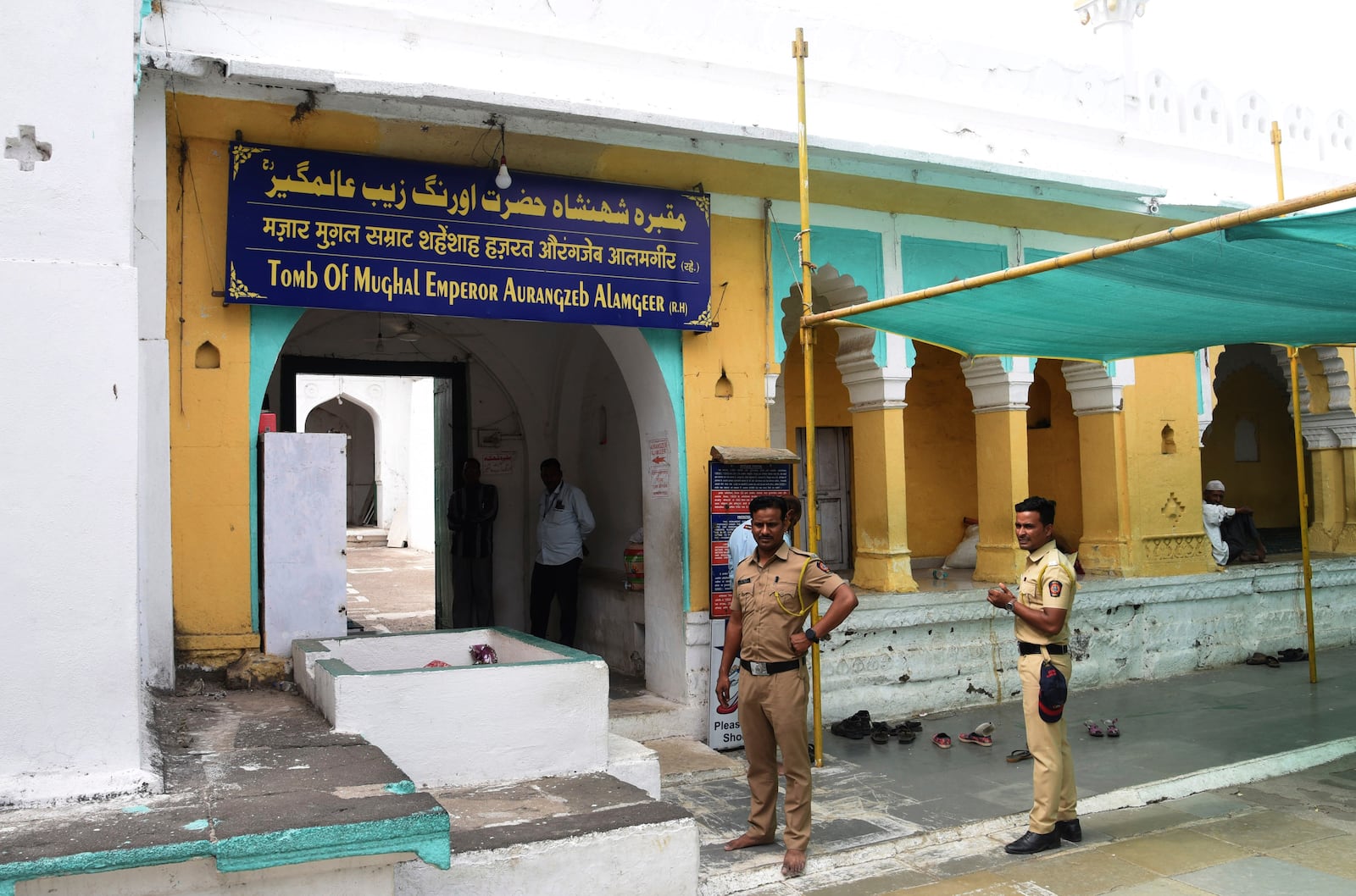 FILE -May 20, 2022 file photo showing policemen standing guard at the mausoleum of 17th century Mughal emperor Aurangzeb in Aurangabad, India, (AP Photo, File)