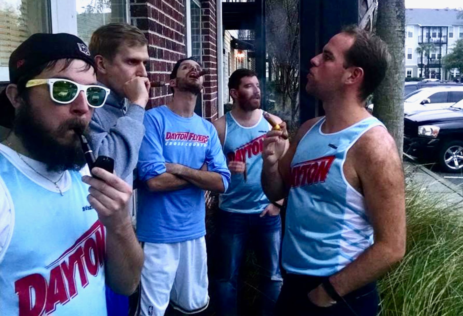 Members of the 2003 Dayton Flyers cross country team show off their old Chapel Blue uniforms they wore for one season. Contributed photo