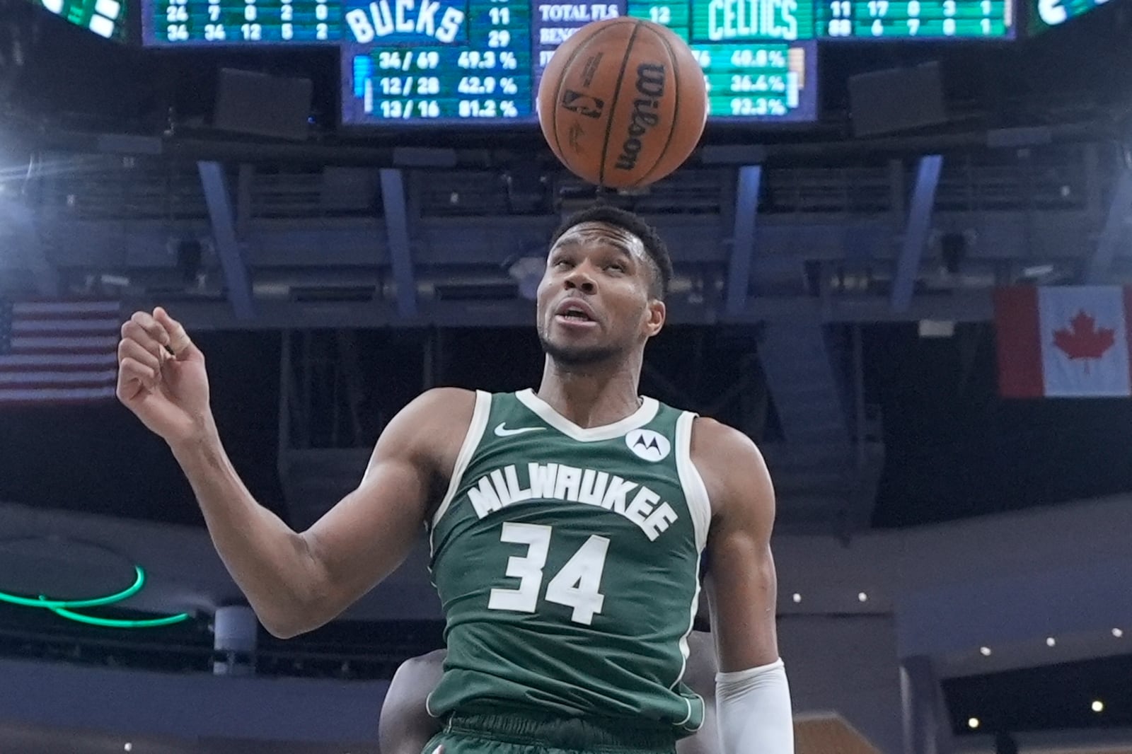 Milwaukee Bucks' Giannis Antetokounmpo hits the ball with his head after a shot during the second half of an NBA basketball game against the Boston Celtics Sunday, Nov. 10, 2024, in Milwaukee. (AP Photo/Morry Gash)