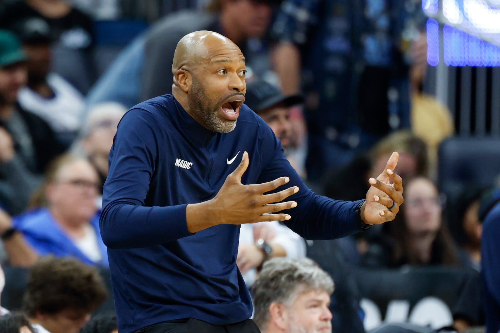 Orlando Magic head coach Jamahl Mosley reacts as his team plays the Miami Heat during the second half of an NBA basketball game, Thursday, Dec. 26, 2024, in Orlando, Fla. (AP Photo/Kevin Kolczynski)