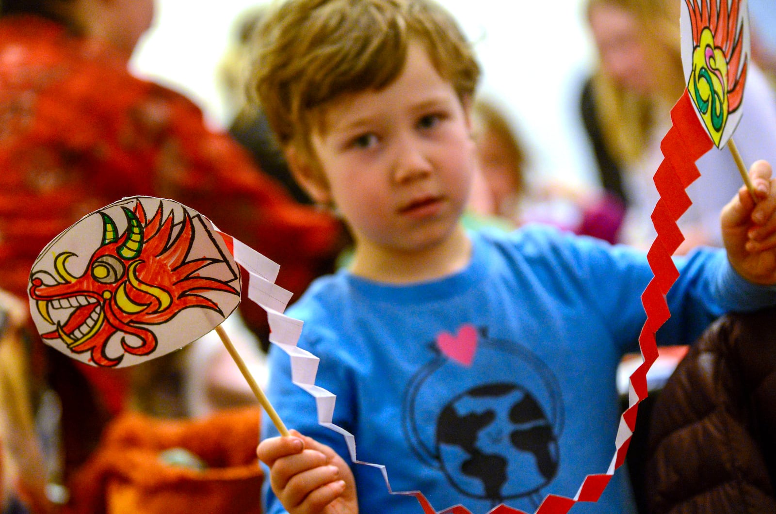 FILE - Bennett Morse, 5, of Guilford, Vt., shows off a dragon he made during the Asian Cultural Center of Vermont's annual Lunar New Year Festival at the Brattleboro Museum and Arts Center in Brattleboro, Vt., Feb. 10, 2024. (Kristopher Radder/The Brattleboro Reformer via AP, File)