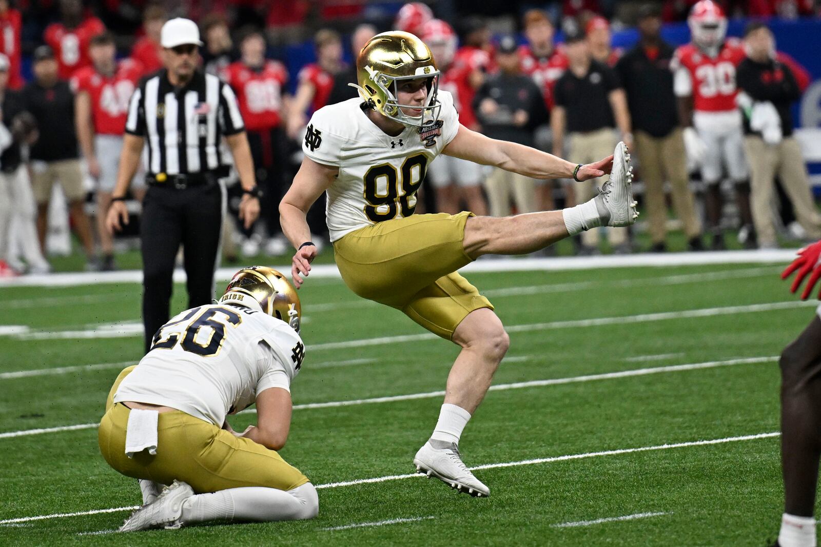 Notre Dame place kicker Mitch Jeter (98) kicks a 44-yard field goal during the first half against Georgia in the quarterfinals of a College Football Playoff, Thursday, Jan. 2, 2025, in New Orleans. (AP Photo/Matthew Hinton)