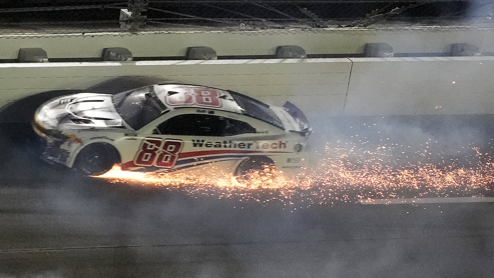 Shane Van Gisbergen (88) crashes during the second of two NASCAR Daytona 500 qualifying auto races Thursday, Feb. 13, 2025, at Daytona International Speedway in Daytona Beach, Fla. (AP Photo/Chris O'Meara)