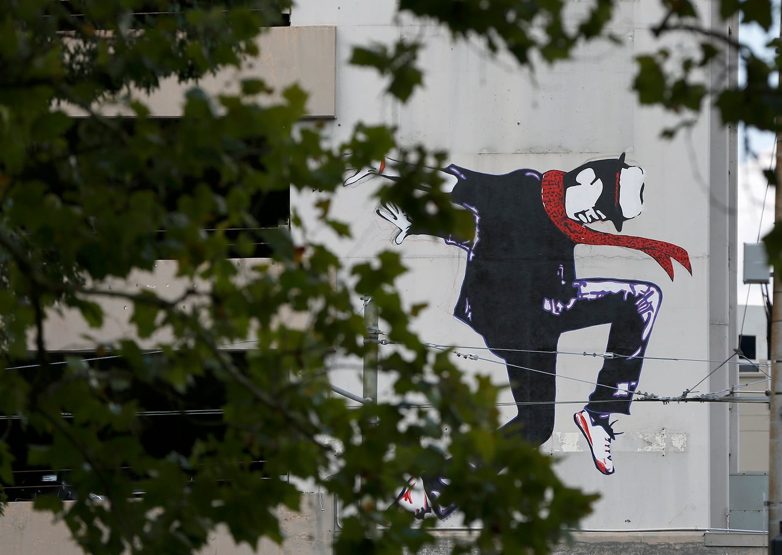 A lone dancer â caught mid-stride- spans two floors of a parking garage on the northwest corner of Jefferson and Fourth streets in downtown Dayton. LISA POWELL / STAFF