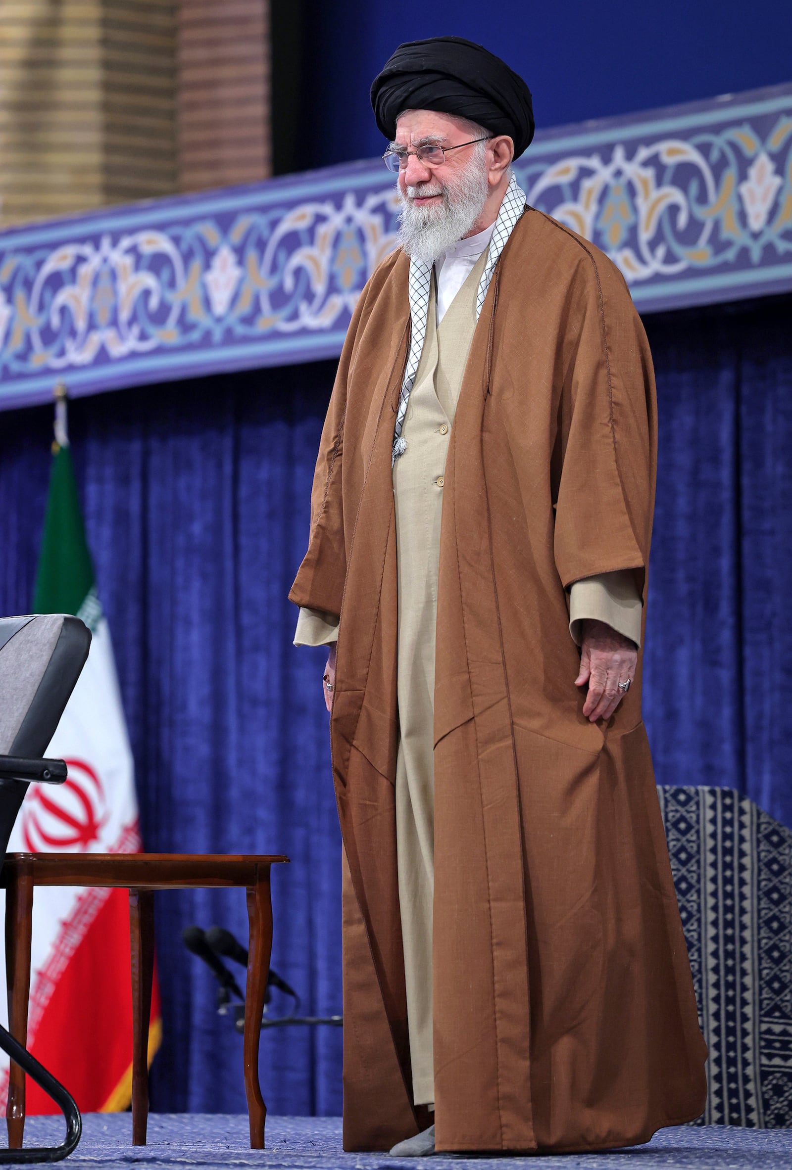 In this photo released by an official website of the office of the Iranian supreme leader, Supreme Leader Ayatollah Ali Khamenei listens to the national anthem at the start of a meeting with a group of air force officers in Tehran, Iran, Friday, Feb. 7, 2025. (Office of the Iranian Supreme Leader via AP)