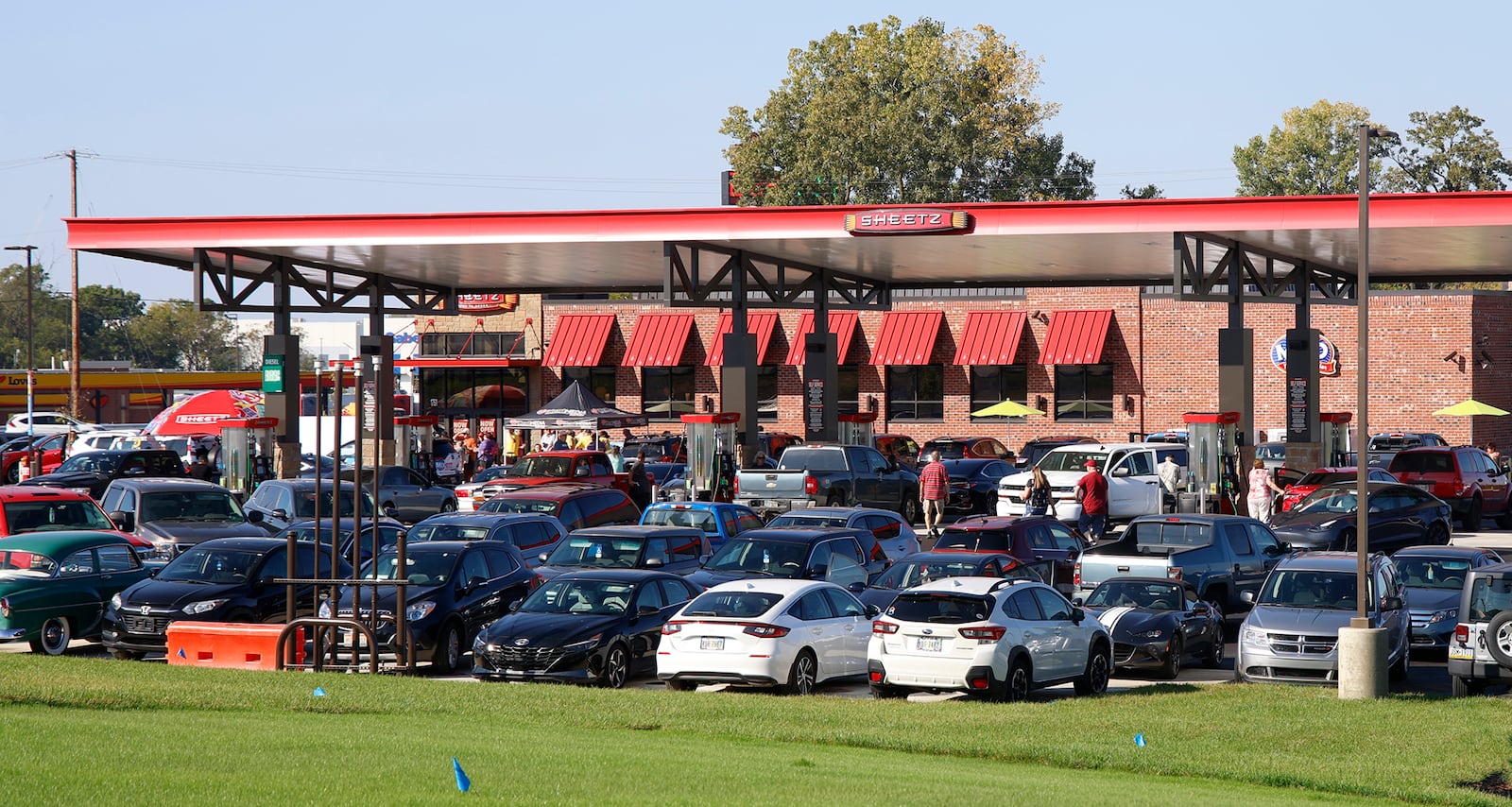 Hundreds of people visit the new Sheetz in Springfield Twp. Tuesday, Oct. 3, 2023 during their grand opening. The new gas station, convenience store and restaurant is located at 4700 S. Charleston Pike. The grand opening offered give aways, raffle prizes and cheap gas. The new Sheetz is the company's 89th store in Ohio. BILL LACKEY/STAFF